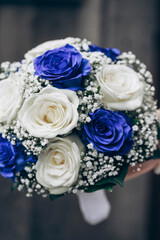Wedding, bouquet, bride, roses, blue roses, white roses, elegance, bridal, gown, tradition, love, celebration, beauty, flowers, stylish, vibrant, wedding day.