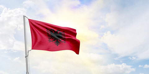 Albania flag waving on sky background. 3D Rendering