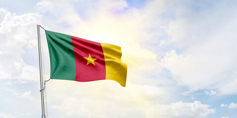 Cameroon flag waving on sky background. 3D Rendering