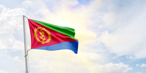 Eritrea flag waving on sky background. 3D Rendering
