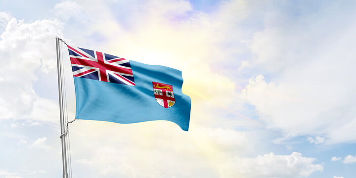Fiji flag waving on sky background. 3D Rendering