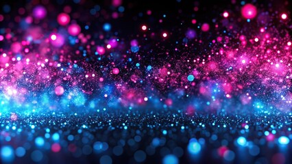 Aerial view of pink and blue neon sparkles on black background