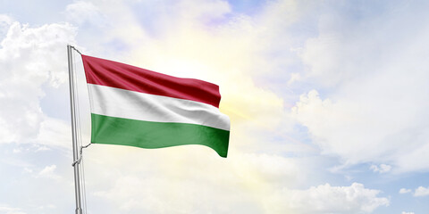 Hungary flag waving on sky background. 3D Rendering