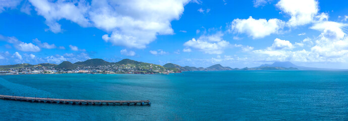 Panoramic view of Saint Kitts and Nevis harbor ocean shore with scenic beaches and landscapes.