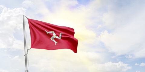Isle of Man flag waving on sky background. 3D Rendering