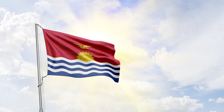 Kiribati flag waving on sky background. 3D Rendering