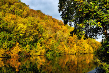 Landscape with autumn colours along a river