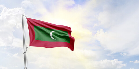 Maldives flag waving on sky background. 3D Rendering