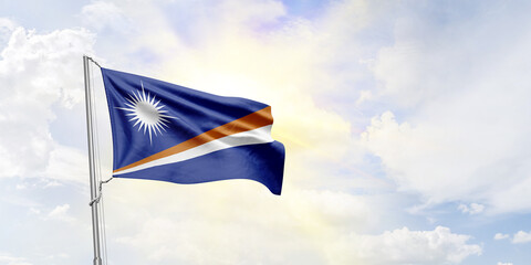 Marshall Islands flag waving on sky background. 3D Rendering