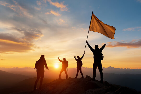 Silhouetted against a vibrant sunrise, a group of climbers celebrates on a mountain summit, one holding a flag in triumph