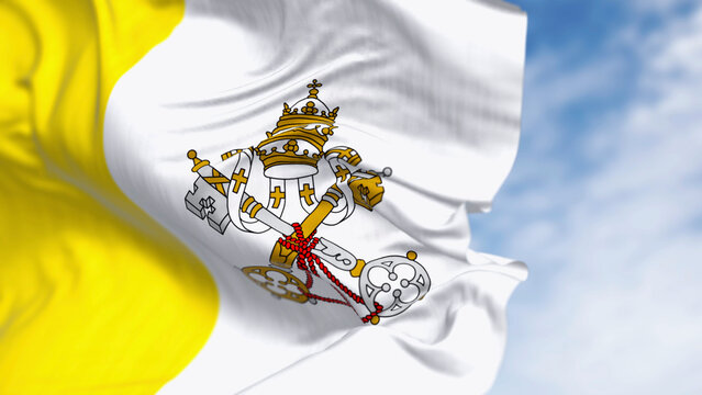 Flag of Vatican City waving in the wind on a clear day