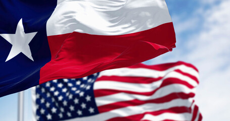Texas state flags waving in the wind with american flag © rarrarorro