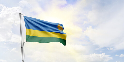 Rwanda flag waving on sky background. 3D Rendering