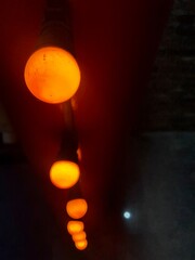 round orange lanterns as a background near the club