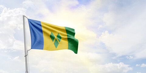 Saint Vincent and the Grenadines flag waving on sky background. 3D Rendering