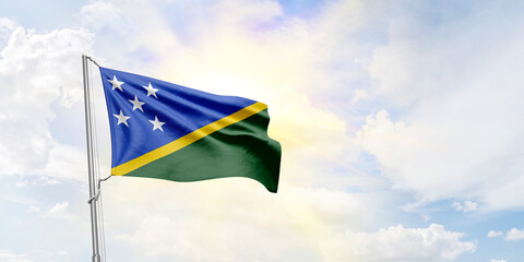 Solomon Islands flag waving on sky background. 3D Rendering