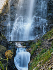 Waterfall crossed by a bridge Gorgas de Alba, Benasque, Aragón, Spain