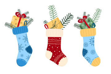 Christmas charming illustration of three festive stockings filled with gifts, pine branches on white background. Cute vector symbols of warm family Christmas evenings. For holiday decor, cards, poster
