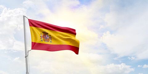Spain flag waving on sky background. 3D Rendering