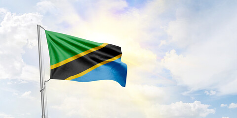 Tanzania flag waving on sky background. 3D Rendering