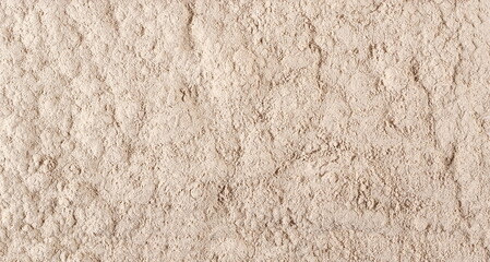 Ceramic tile adhesive, pile of dry cement background and texture, top view