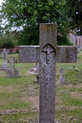 Christian Cross grave memorial with inlay representation of Christ crucified. 
