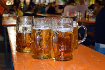 close up of one liter beer mugs