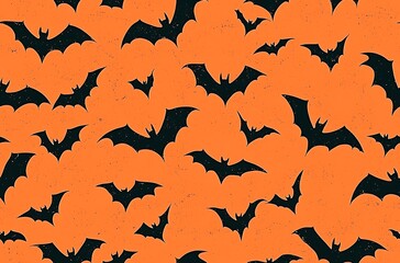 Orange background black bat silhouettes flying in the sky