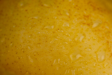 delicious yellow pears with red sides covered with water