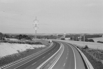 highway D7 near  Panensky Tynec in Czechia on 8. July 2024 on black and white film - blurriness and noise of scanned 35mm film were intentionally left in image