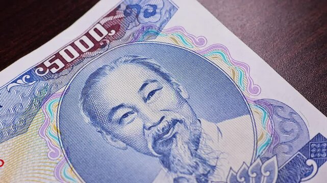 Close up view of brand new vietnamese 5000 dong banknote. Money background.