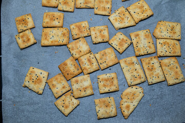 Homemade salted, sesame and nigella biscuits, freshly baked in the oven.