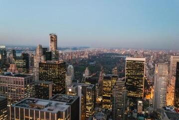 Fototapeta premium The city skyline is lit up at night