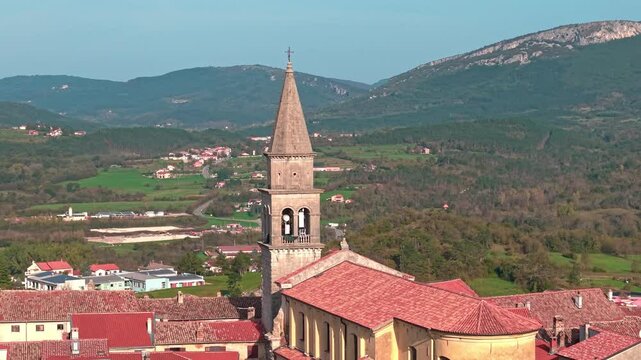 Aerial cinematic view of the Parish Church of St. Mary&rsquo;s Assumption in ancient hill town of Buzet on the Istrian peninsula, Croatia