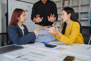 Office Conflict: Two businesswomen engage in a heated disagreement, while a male colleague attempts to mediate. The scene depicts workplace tension and the challenges of communication.