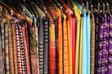 many fine fabrics for sale in a haberdashery specializing in supplies for artisan tailors