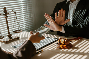 Lawyer refusing bribe from businesswoman at meeting about contract, concept of corruption and anti...