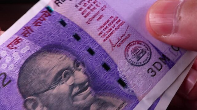 Close up view of brand new indian rupees banknotes. Money background.