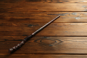 One old magic wand on wooden table