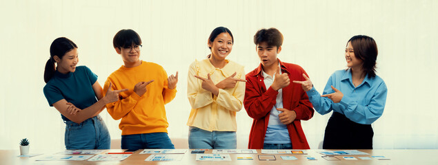 Panoramic banner young happy asian startup company employee wearing colorful casual wear stand in...