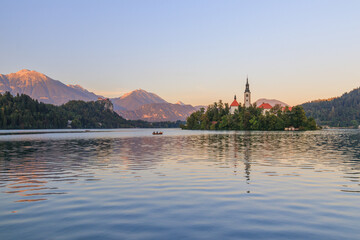 Lake bled in the slovenian alps slovenia during sunset with warm golden light golden hour