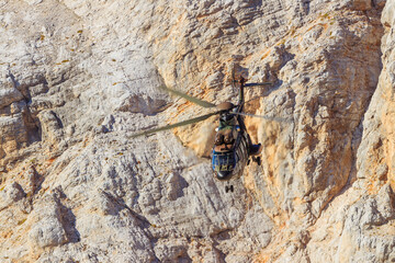 Slovenian military helicopter flying in the slovenian alps julian alps