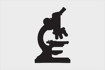 Silhouette of a classic laboratory microscope.