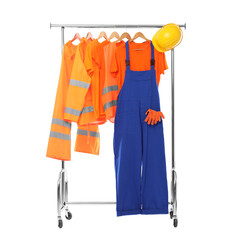 Workers' uniforms on clothing rack isolated on white