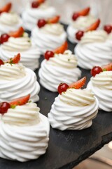 Assorted Meringue Desserts with Strawberries