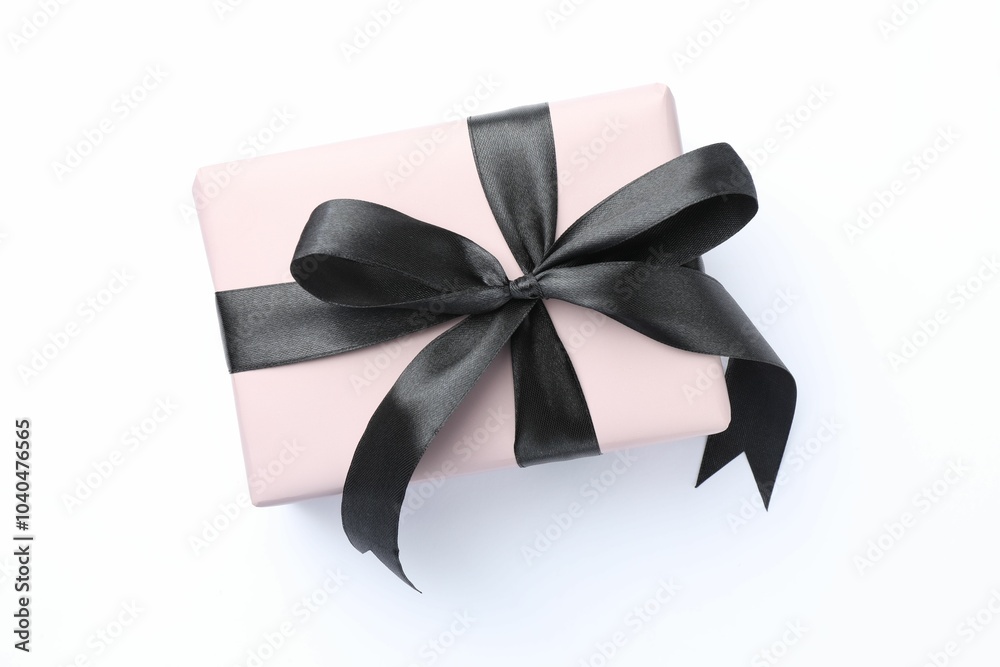 Sticker Beautiful gift box with black bow isolated on white, top view