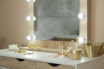 Stylish dressing table with mirror in room