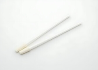 Isolated swabs are placed on a clean white surface for examination and testing purposes regularly.