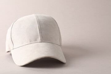 Stylish baseball cap on light grey background, closeup. Mockup for design
