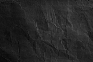Fototapeta premium Crumpled dark grey background paper texture